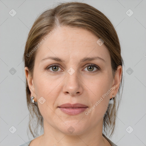 Joyful white adult female with medium  brown hair and grey eyes