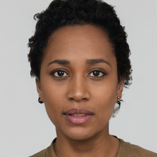 Neutral black young-adult female with short  black hair and brown eyes