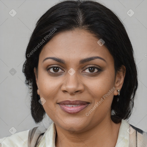 Joyful black adult female with medium  brown hair and brown eyes