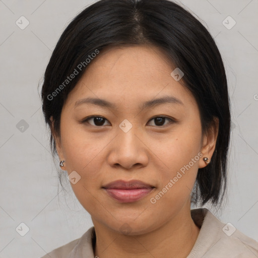 Joyful asian young-adult female with medium  brown hair and brown eyes