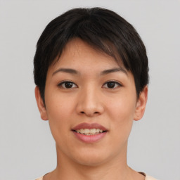 Joyful asian young-adult female with short  brown hair and brown eyes