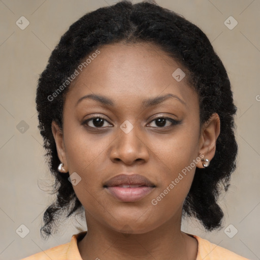 Joyful black young-adult female with medium  black hair and brown eyes