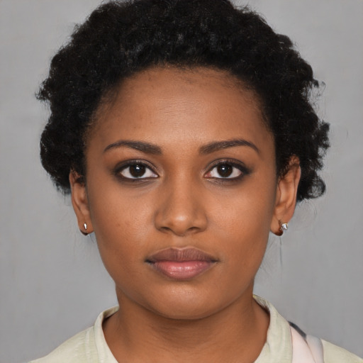 Neutral black young-adult female with short  black hair and brown eyes