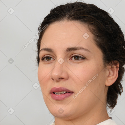 Joyful white adult female with medium  brown hair and brown eyes