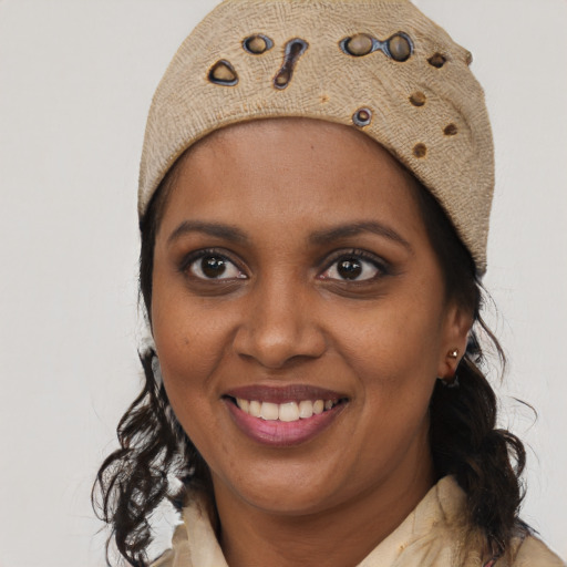 Joyful black young-adult female with medium  brown hair and brown eyes