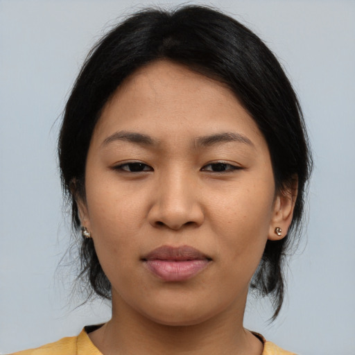 Joyful asian young-adult female with medium  brown hair and brown eyes