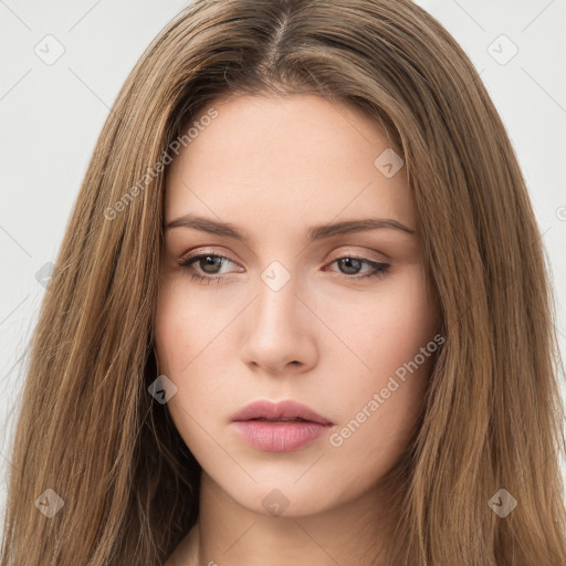 Neutral white young-adult female with long  brown hair and brown eyes