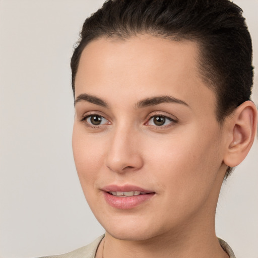 Joyful white young-adult female with short  brown hair and brown eyes