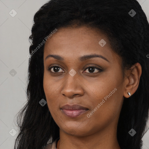 Joyful black young-adult female with long  brown hair and brown eyes