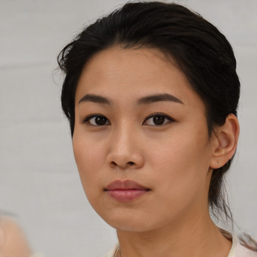 Neutral asian young-adult female with medium  black hair and brown eyes