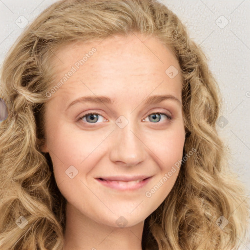 Joyful white young-adult female with long  brown hair and blue eyes