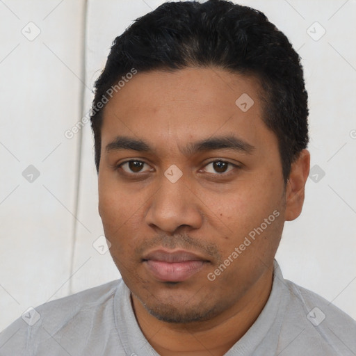Neutral latino young-adult male with short  black hair and brown eyes