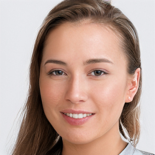 Joyful white young-adult female with long  brown hair and grey eyes