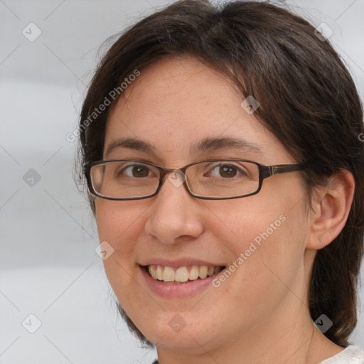 Joyful white adult female with medium  brown hair and brown eyes