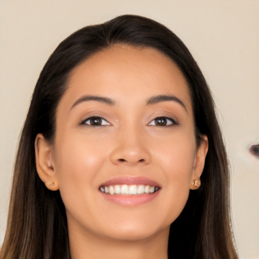 Joyful asian young-adult female with long  brown hair and brown eyes