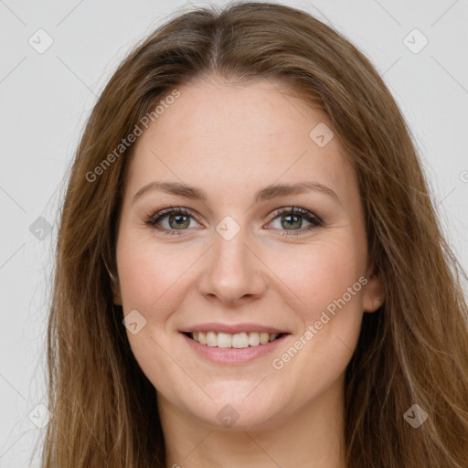 Joyful white young-adult female with long  brown hair and green eyes