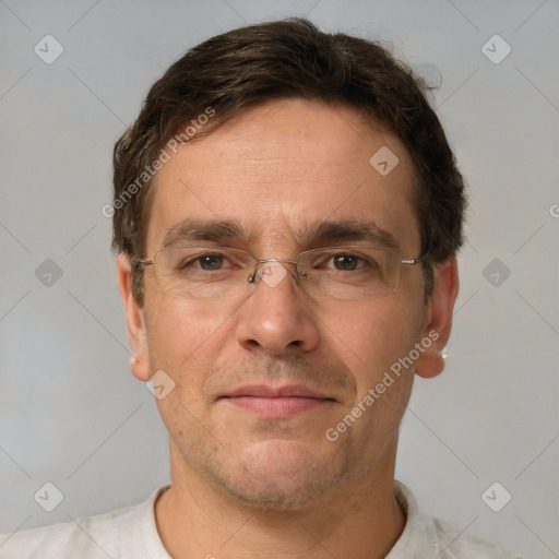 Joyful white adult male with short  brown hair and grey eyes