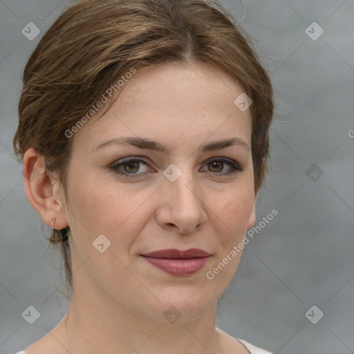 Joyful white young-adult female with medium  brown hair and green eyes