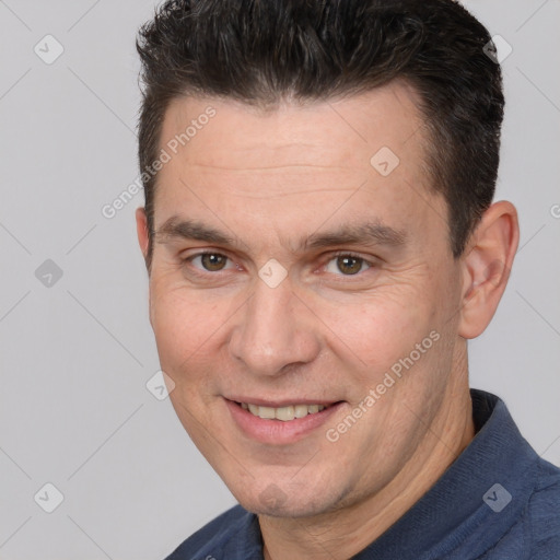 Joyful white adult male with short  brown hair and brown eyes