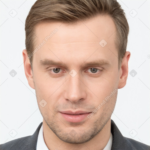 Joyful white young-adult male with short  brown hair and grey eyes