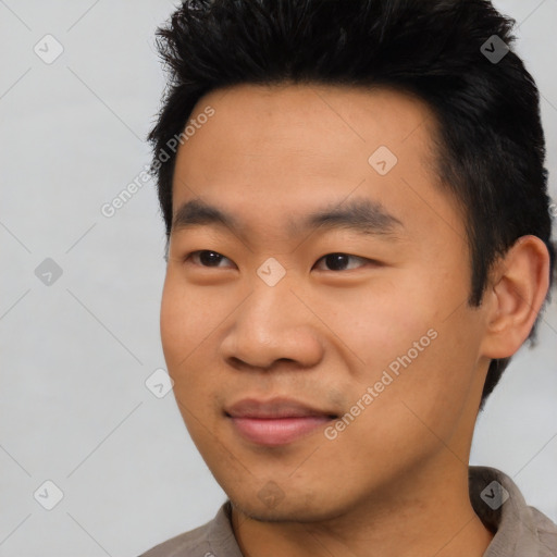 Joyful asian young-adult male with short  black hair and brown eyes