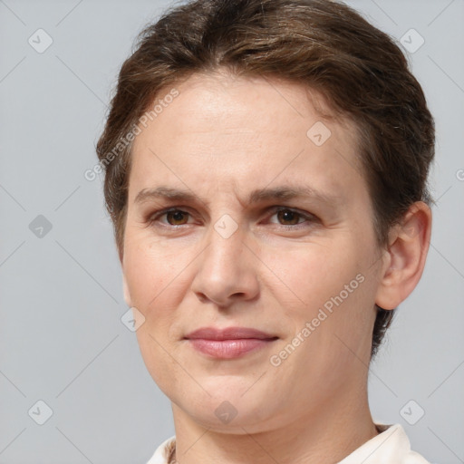 Joyful white adult female with short  brown hair and brown eyes