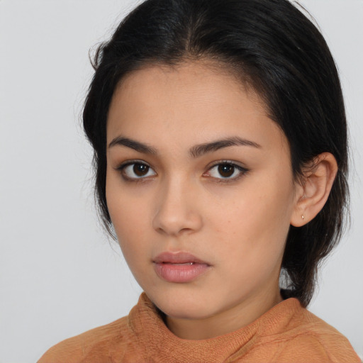 Neutral latino young-adult female with medium  brown hair and brown eyes