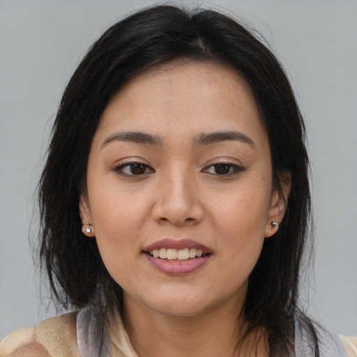 Joyful asian young-adult female with medium  brown hair and brown eyes