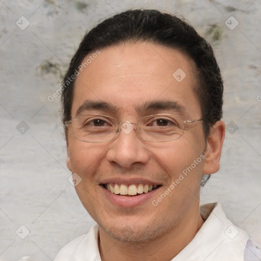 Joyful white adult male with short  brown hair and brown eyes