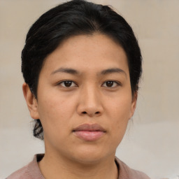 Neutral asian young-adult female with medium  brown hair and brown eyes