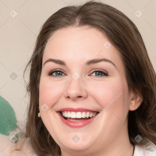 Joyful white young-adult female with medium  brown hair and green eyes