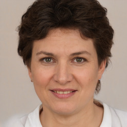 Joyful white adult female with short  brown hair and brown eyes