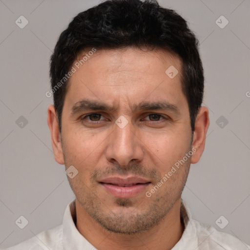 Joyful white adult male with short  brown hair and brown eyes