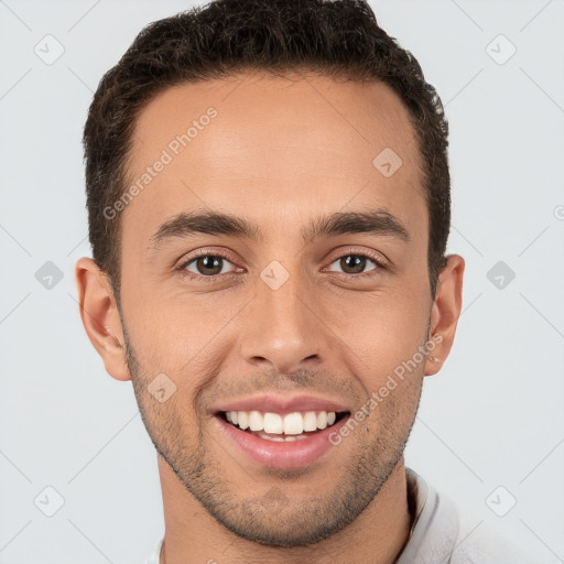 Joyful white young-adult male with short  brown hair and brown eyes