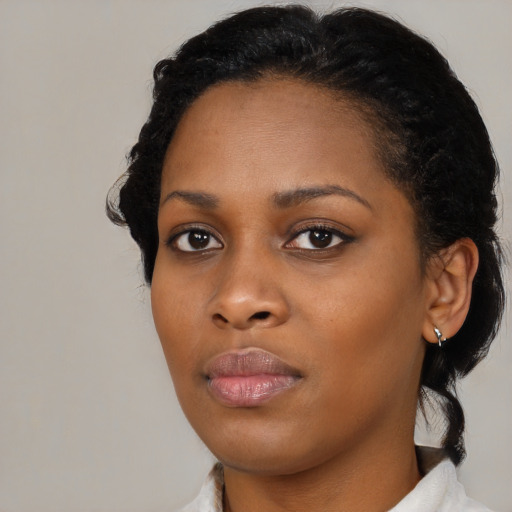Neutral black young-adult female with short  black hair and brown eyes