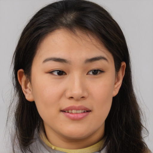 Joyful asian young-adult female with medium  brown hair and brown eyes