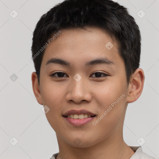 Joyful asian young-adult male with short  black hair and brown eyes