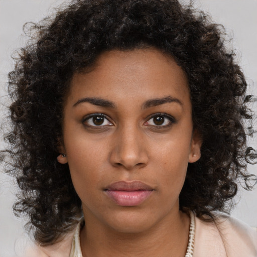 Neutral black young-adult female with long  brown hair and brown eyes