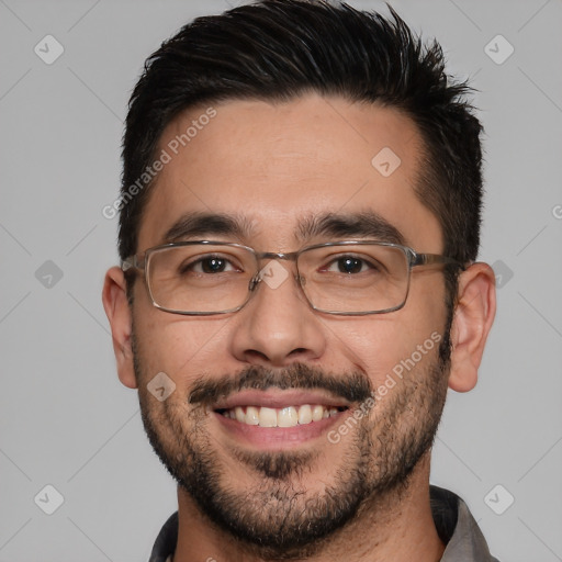 Joyful white adult male with short  brown hair and brown eyes