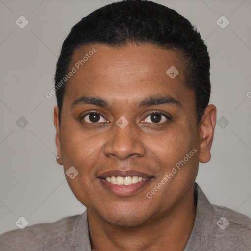 Joyful black young-adult male with short  black hair and brown eyes