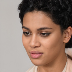 Joyful latino young-adult female with short  black hair and brown eyes