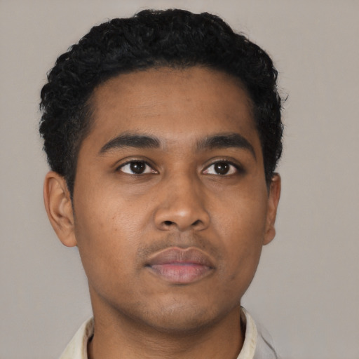 Neutral latino young-adult male with short  black hair and brown eyes