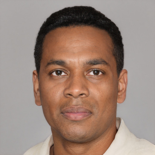 Neutral black adult male with short  black hair and brown eyes