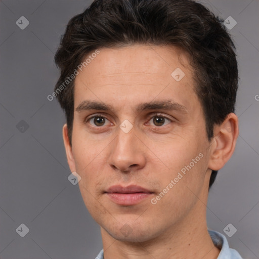 Joyful white adult male with short  brown hair and brown eyes