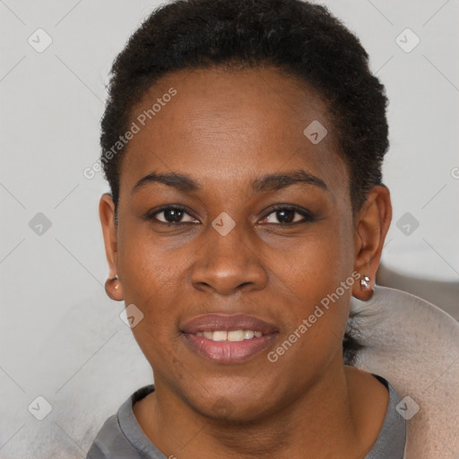 Joyful black young-adult female with short  brown hair and brown eyes