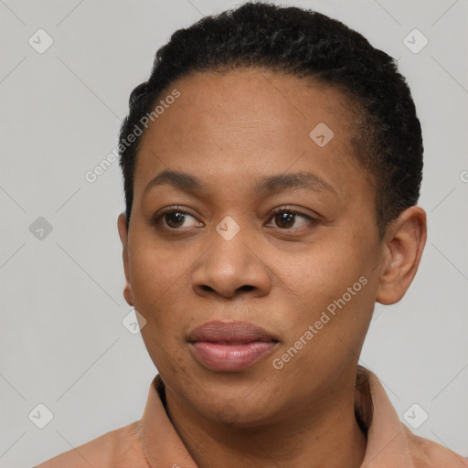 Joyful black young-adult female with short  black hair and brown eyes