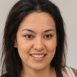 Joyful latino young-adult female with medium  brown hair and brown eyes