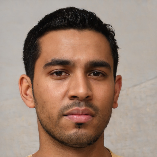 Neutral latino young-adult male with short  black hair and brown eyes