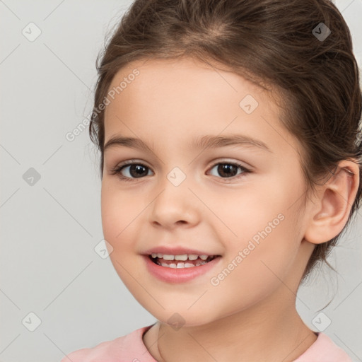 Joyful white child female with medium  brown hair and brown eyes