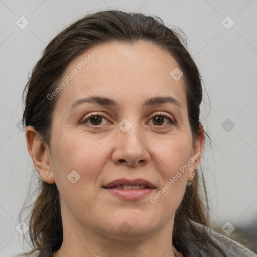 Joyful white adult female with medium  brown hair and brown eyes